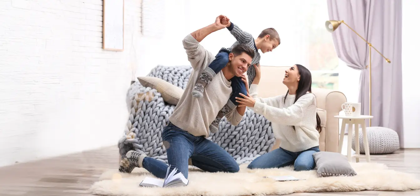 Family playing together in the living room.